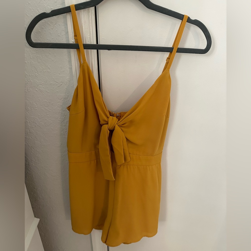 Creamy yellow romper with bow front detail